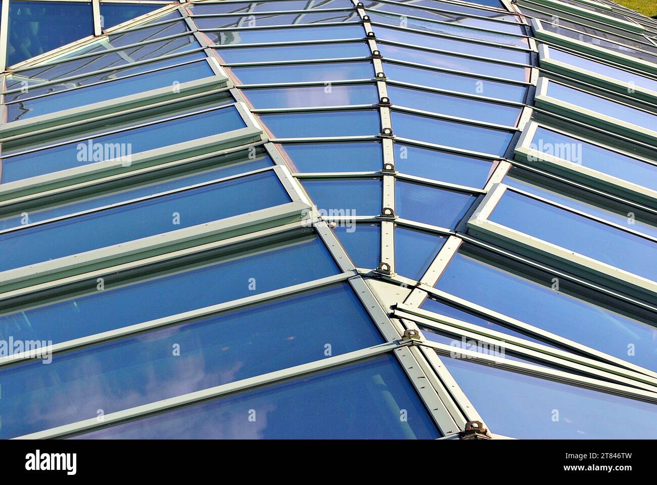 Abstract closeup of the glass-clad facade of a modern building covered ...