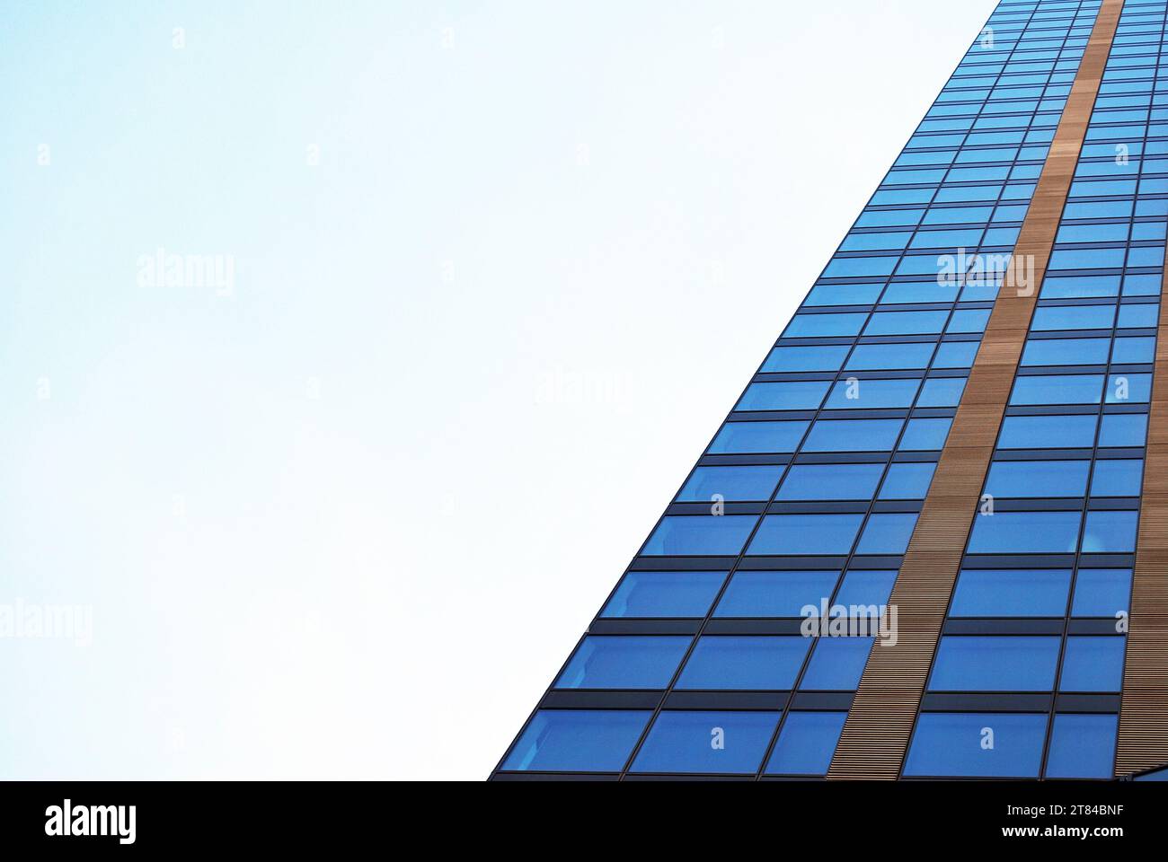 Abstract closeup of the glass-clad facade of a modern building covered ...