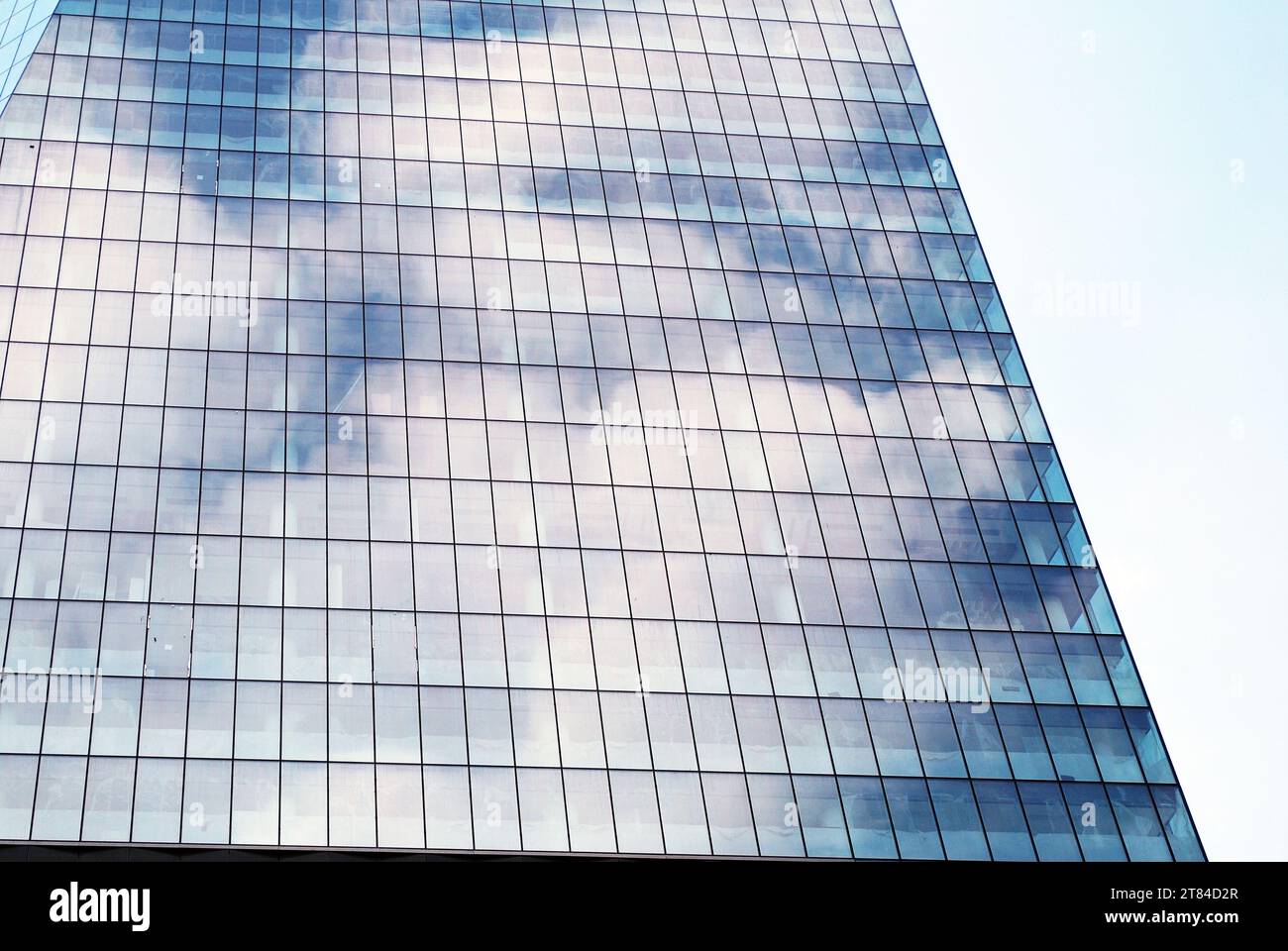 Abstract closeup of the glass-clad facade of a modern building covered ...