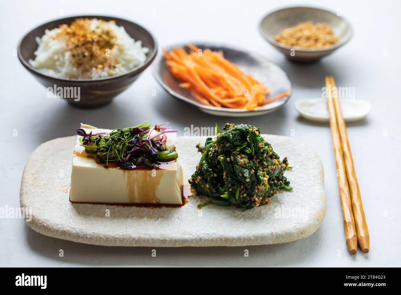 Japanese lunch with silken tofu, spinach gomae Stock Photo Alamy