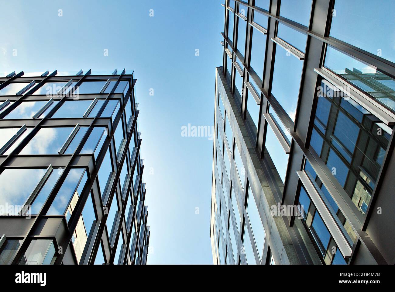 Abstract closeup of the glass-clad facade of a modern building covered ...