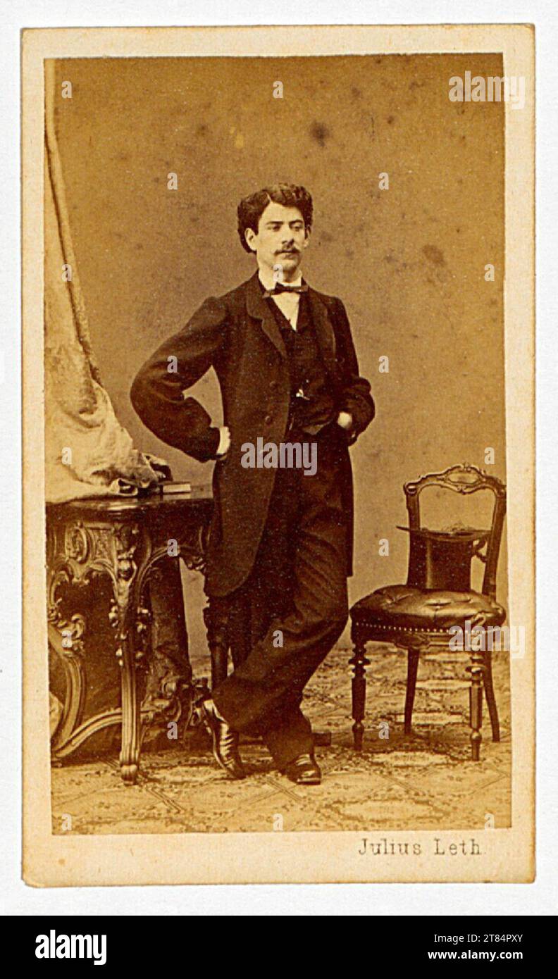 Julius Leth Men's portrait standing between the table and chair. Albuminpapier / Visitformat 1850-1900 , 1850/1900 Stock Photo