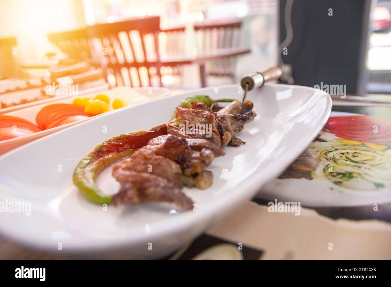 Traditional Turkish Oltu Cag Crochet Shish Kebab doner grilled in wood fired oven. Famous yatik doner kebab from Erzurum cuisine in restaurant. Stock Photo