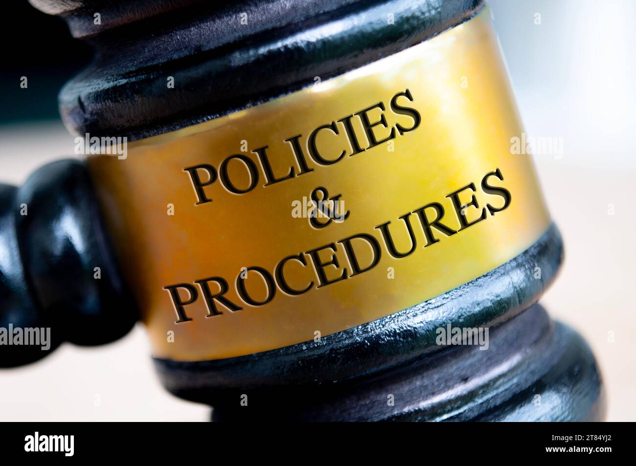 Policies and Procedures text engraved on gavel. Policies and procedures concepts Stock Photo