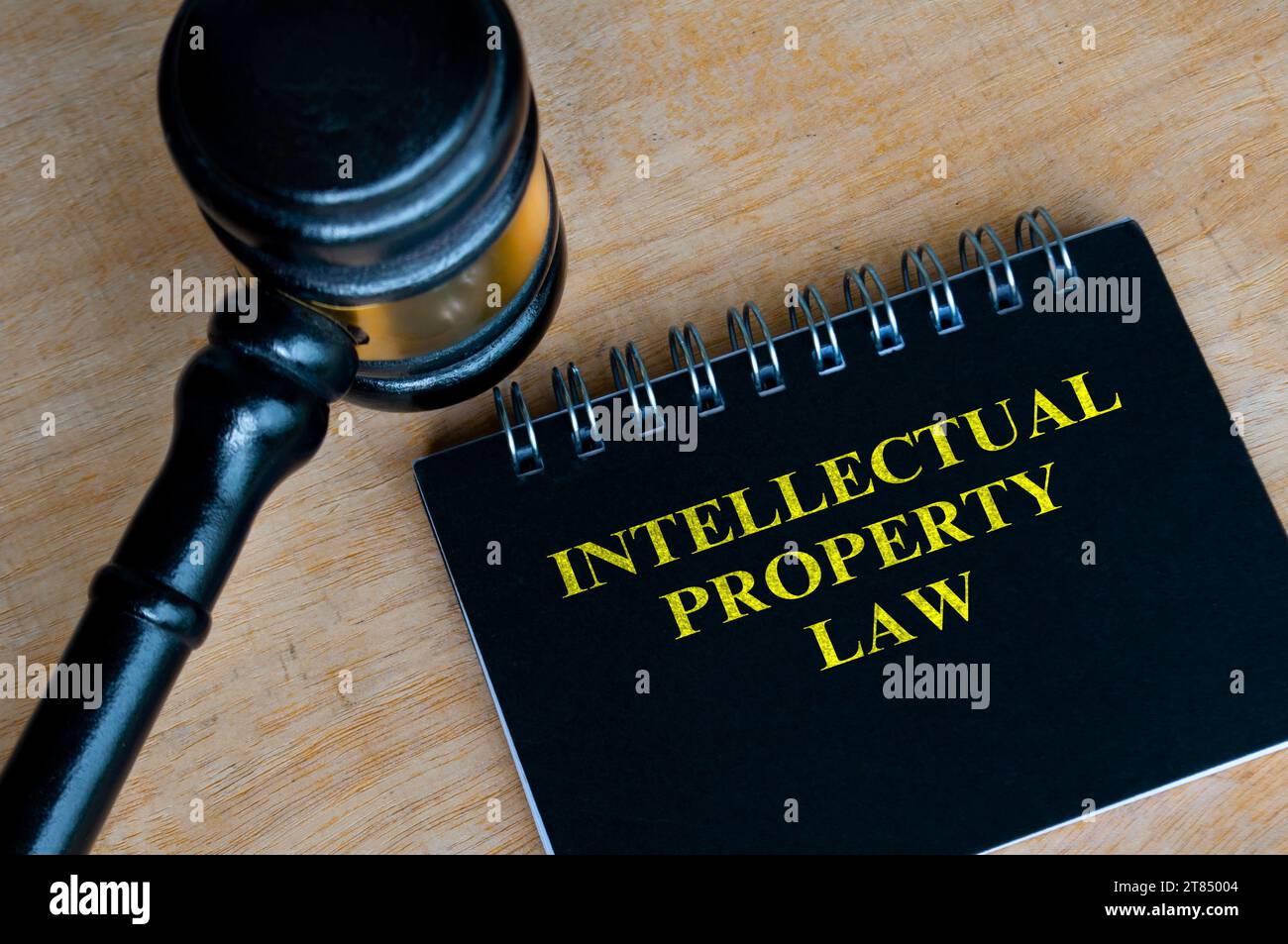Top view of black notebook with text Intellectual Property Law and with gavel background Stock Photo