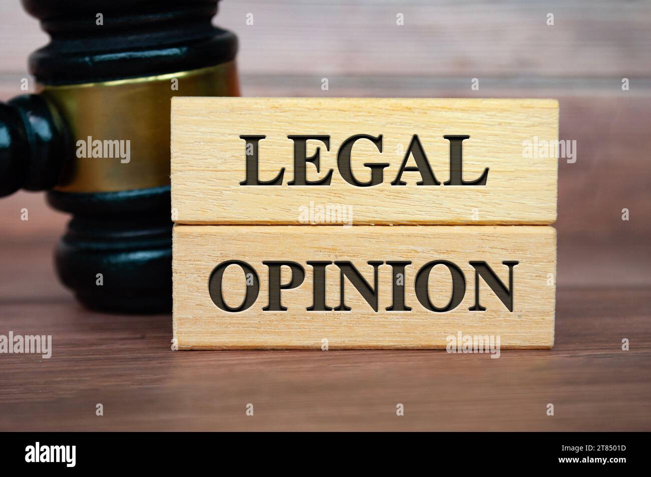 Legal Opinion text on wooden blocks with gavel background. Legal concept Stock Photo