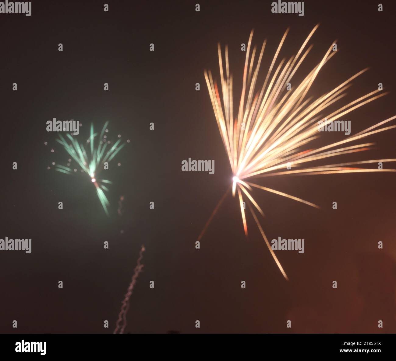 A fireworks display during the new year's Eve night lit up the night sky Stock Photo