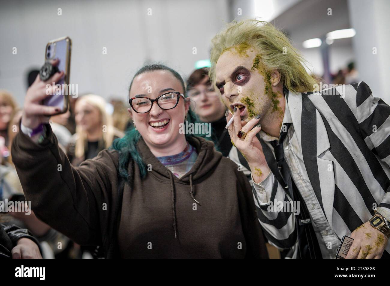 Coventry, UK. 18th November 2023. A fan poses for a selfie with a
