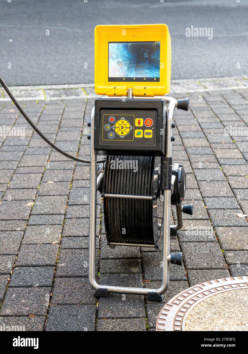 Blocked pipe. Drain inspection with camera. Screen shows the cleaning process of the blocked