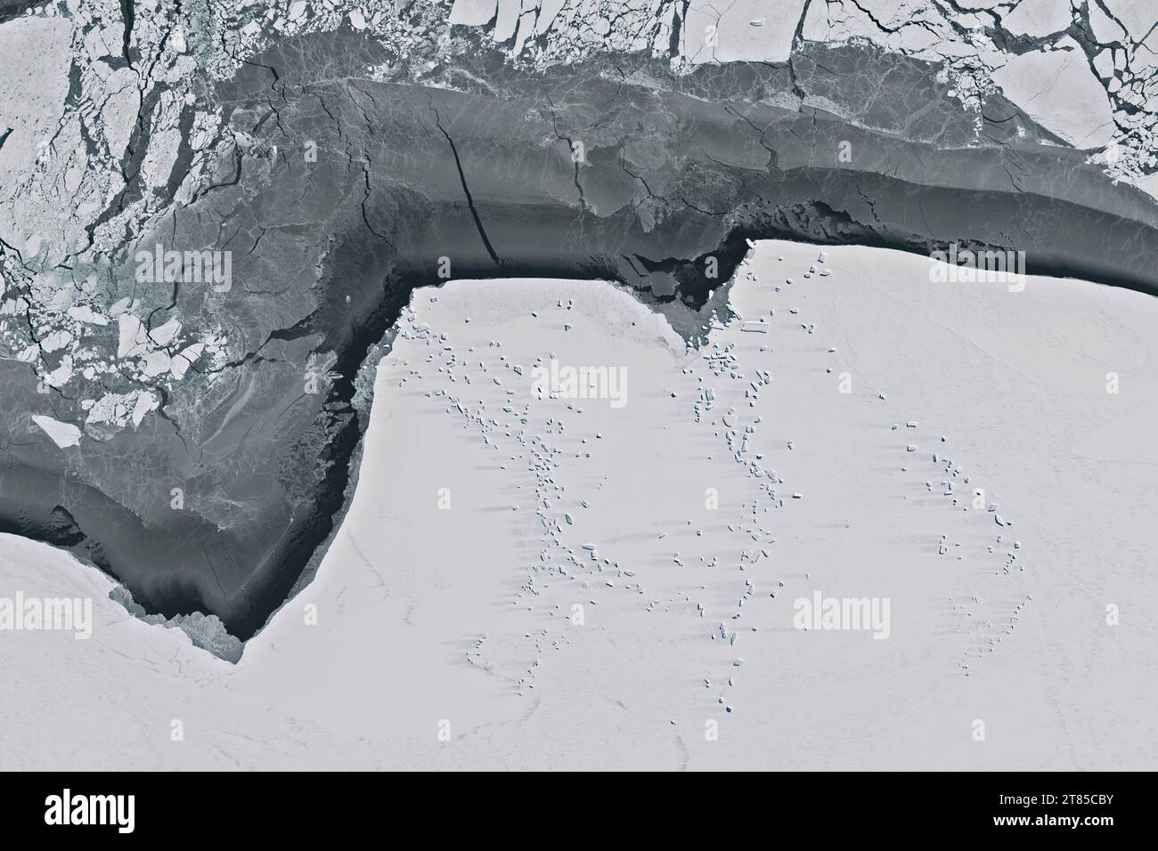 Aerial of icebergs trapped in fast ice on the coast of East Antarctica ...
