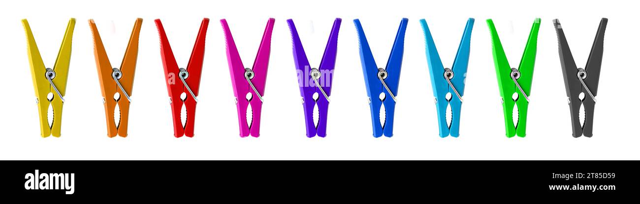 Color plastic clothespins on a white background. Stock Photo