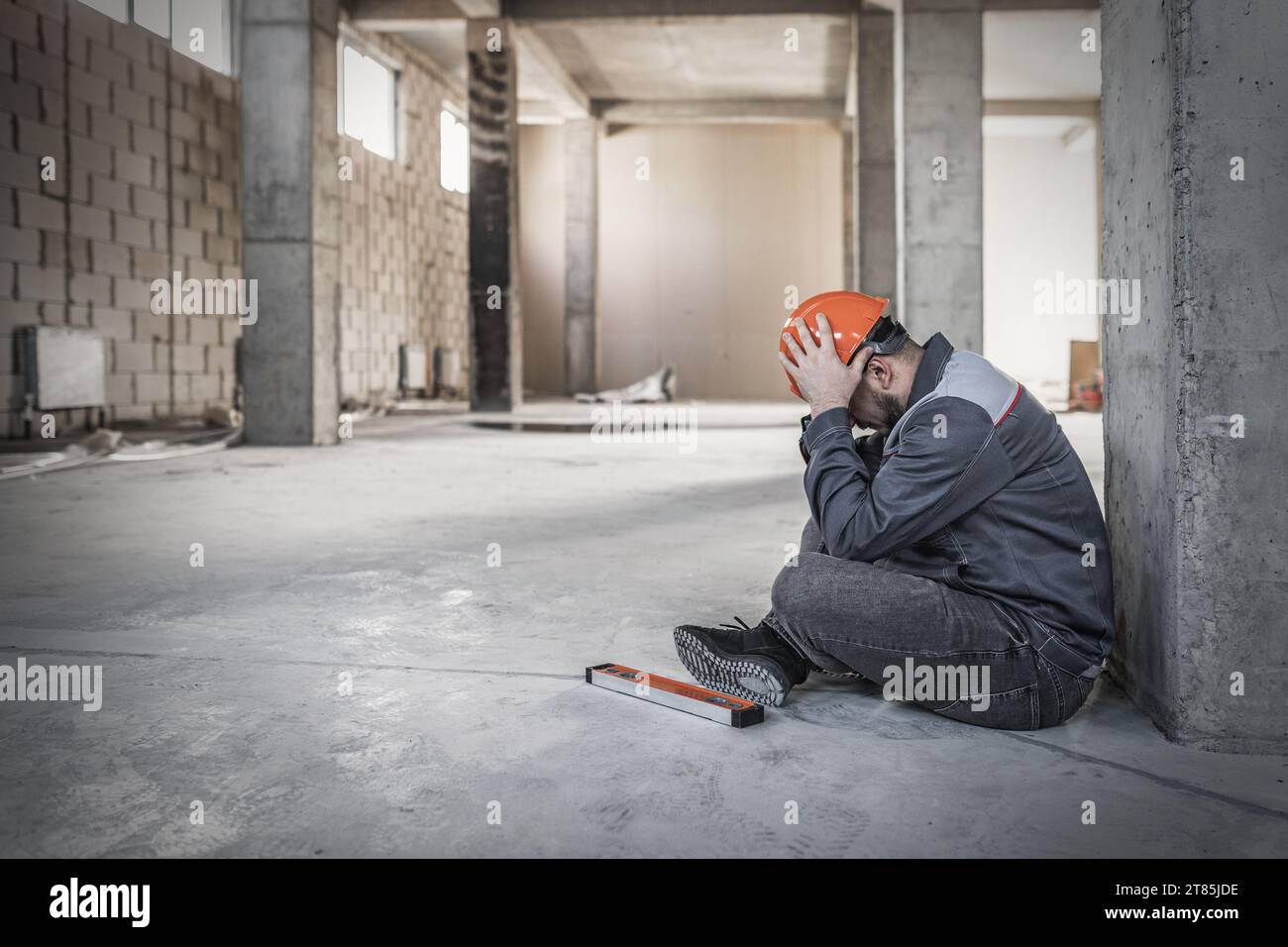 Builder man holding his head on construction site, health problems ...