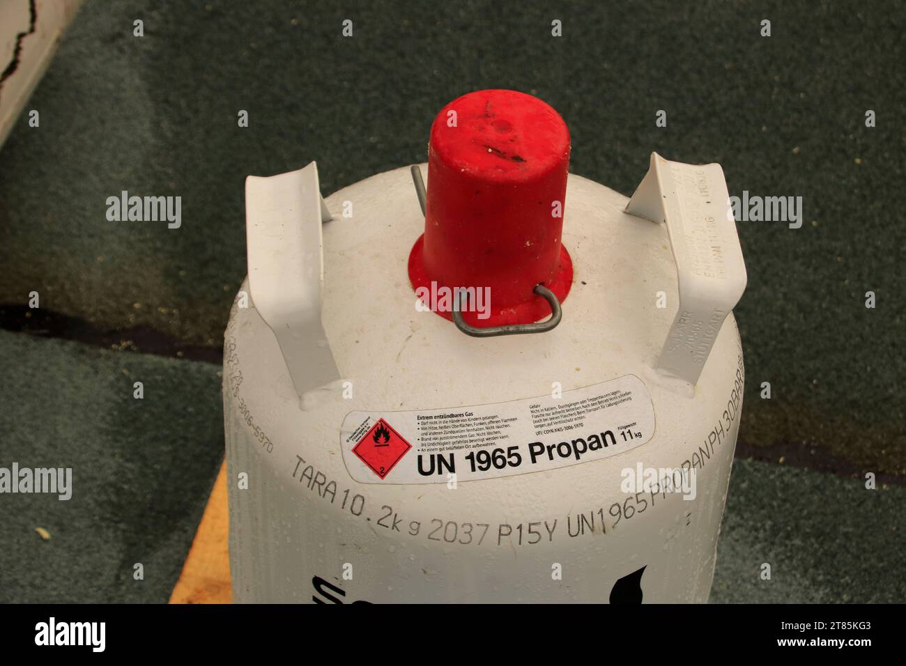The valve on a propane gas cylinder is protected with a cap Stock Photo