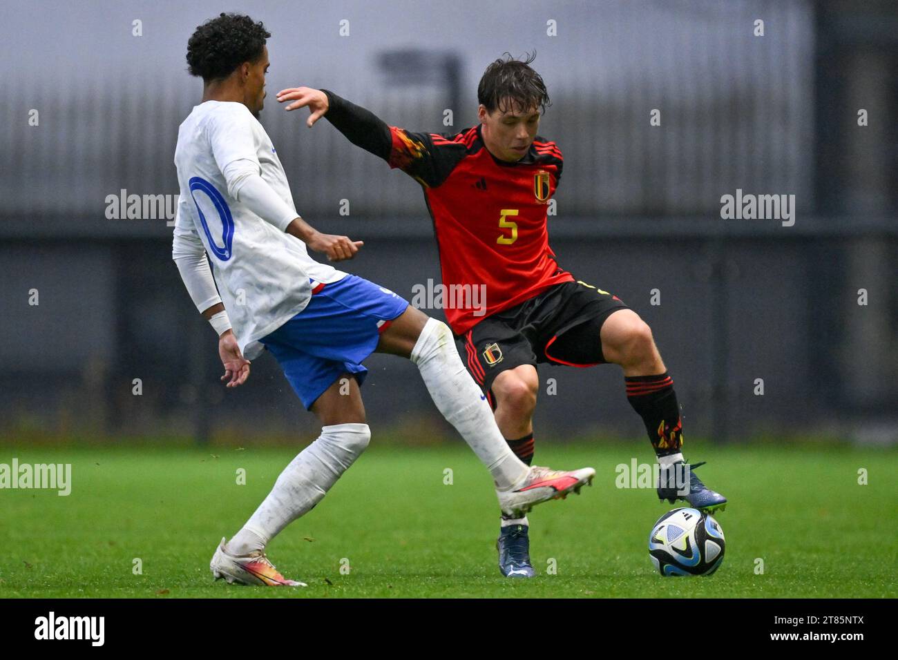 Tubize, Belgium. 18th Nov, 2023. Therence KOUDOU (20) of France pictured defending on Arnaud Dony (5) of Belgium during a friendly soccer game between the national under 20 teams of Belgium and France on Saturday 18 November 2023 in Tubize, Belgium . Credit: sportpix/Alamy Live News Stock Photo