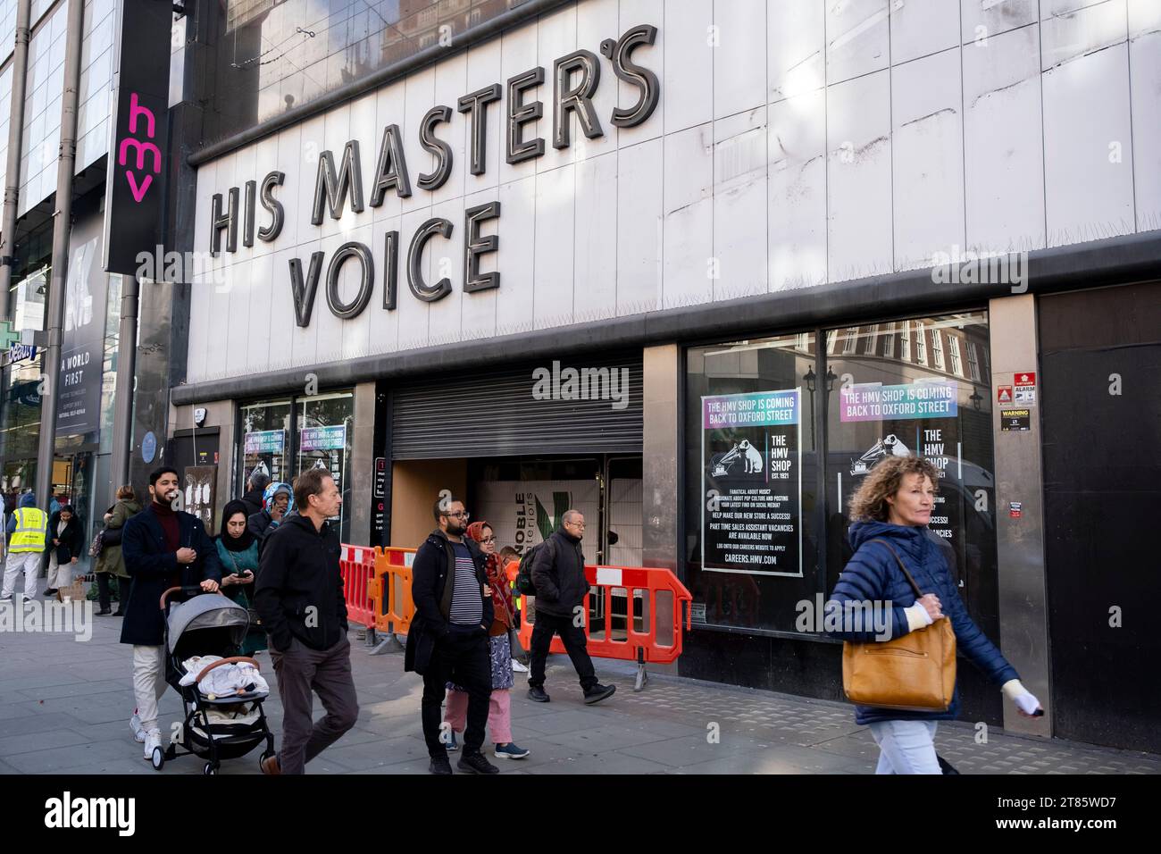 His Masters Voice sign revealed again above HMVs flagship store on Oxford Street which is set to return as the HMV shop once more following a period where the vintage sign was covered up and the shop space was occupied by an American Candy Store on 13th November 2023 in London, United Kingdom. Stock Photo