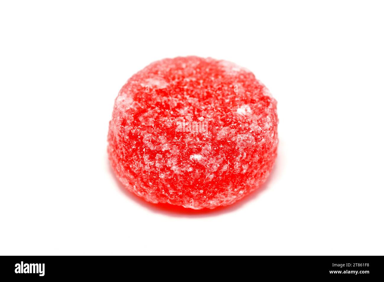 Close up of a red fruit pastille sweet, isolated against a white background. Stock Photo