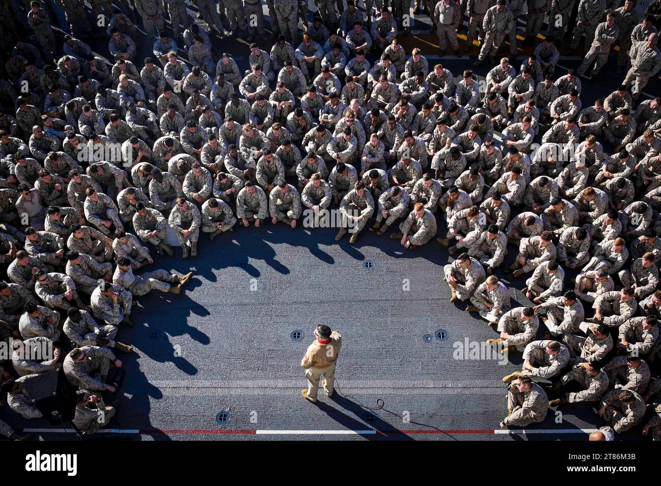 Pacific Ocean. 11th Nov, 2023. USS Boxer (LHD 4) Command Master Chief Jose Ramiro, a native of Santurce, Puerto Rico, welcomes the 15th Marine Expeditionary Unit on the flight deck as the ship steams in the Pacific Ocean, November. 11, 2023. Boxer is currently underway conducting routine operations in U.S. 3rd Fleet. (Credit Image: © U.S. Navy/ZUMA Press Wire) EDITORIAL USAGE ONLY! Not for Commercial USAGE! Stock Photo