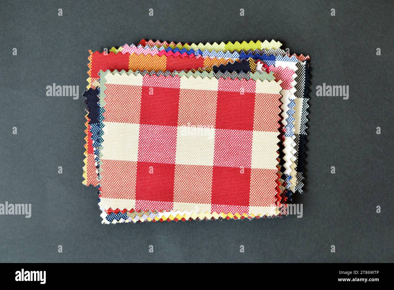 Checkered fabric pattern samples on black background Stock Photo