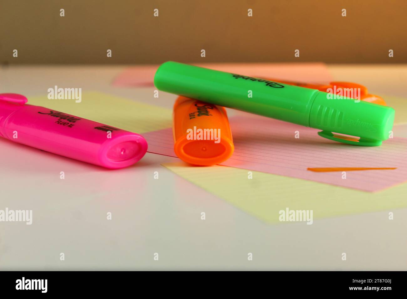 A photo of colourful permanent markers stacked up on top of each other on flashcards on a desk. Stock Photo