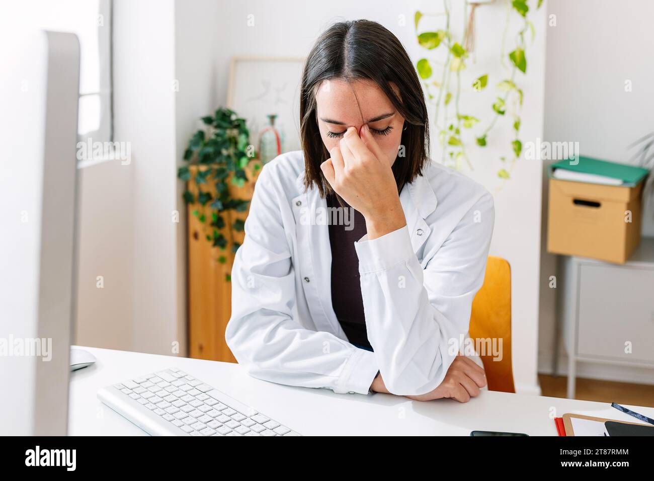 Tired female doctor in hospital hi-res stock photography and images - Alamy