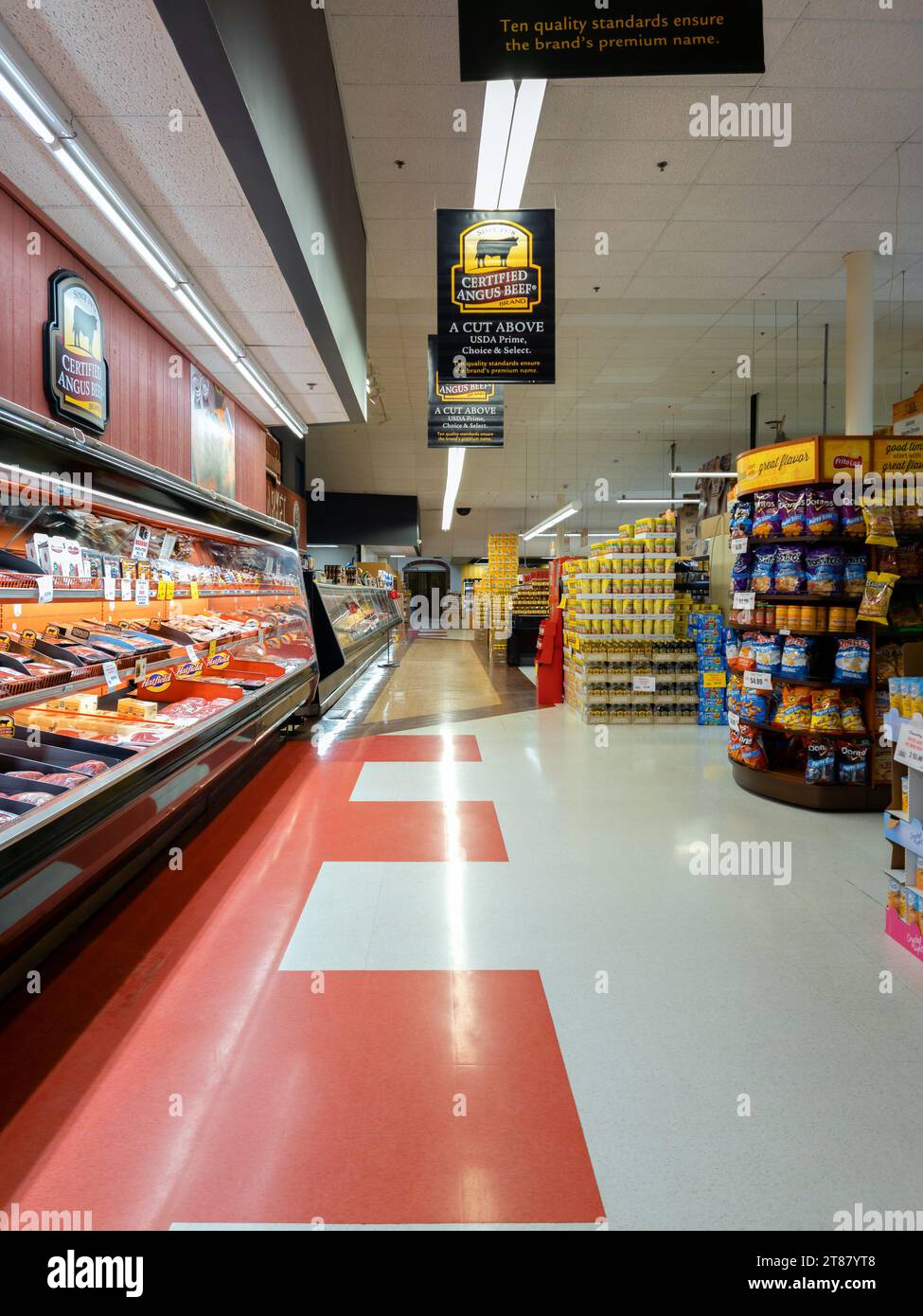 Utica, New York - Nov 6, 2023: Landscape View of the Refrigerated Meat Section of Chanatry's Hometown Market. Stock Photo