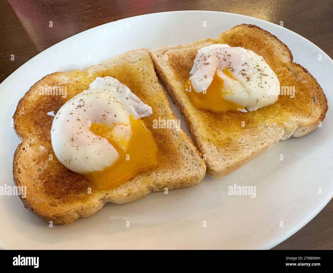 Two poached eggs on toast Stock Photo