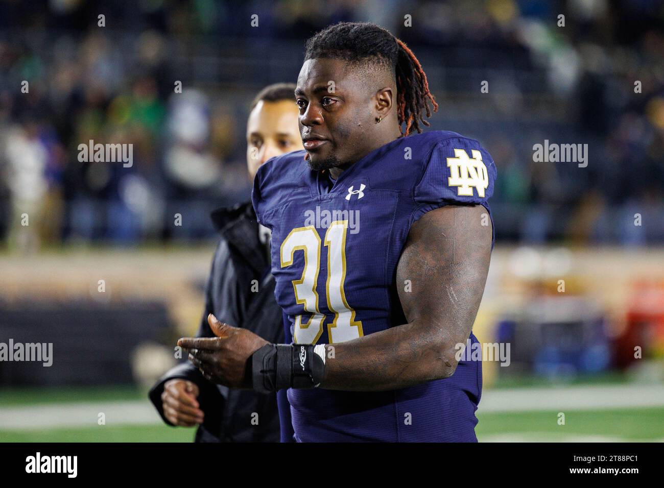 South Bend, Indiana, USA. 18th Nov, 2023. Notre Dame defensive lineman Nana Osafo-Mensah (31) walks off the field with tears in his eyes after NCAA football game action between the Wake Forest Demon Deacons and the Notre Dame Fighting Irish at Notre Dame Stadium in South Bend, Indiana. Notre Dame defeated Wake Forest 45-7. John Mersits/CSM/Alamy Live News Stock Photo