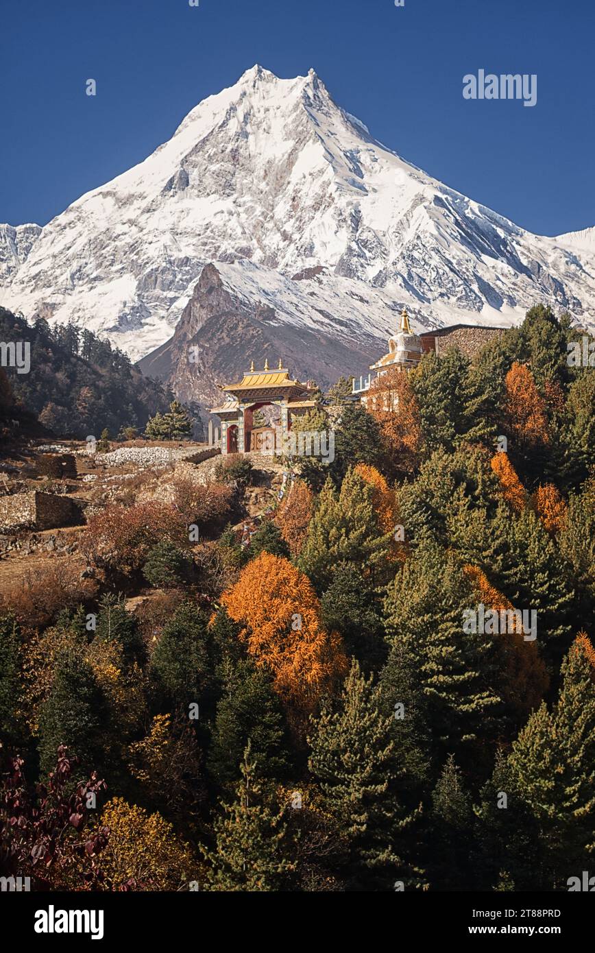 Monastery in Lho with the peak of Manaslu, the World's 8th highest peak, in the background Stock Photo