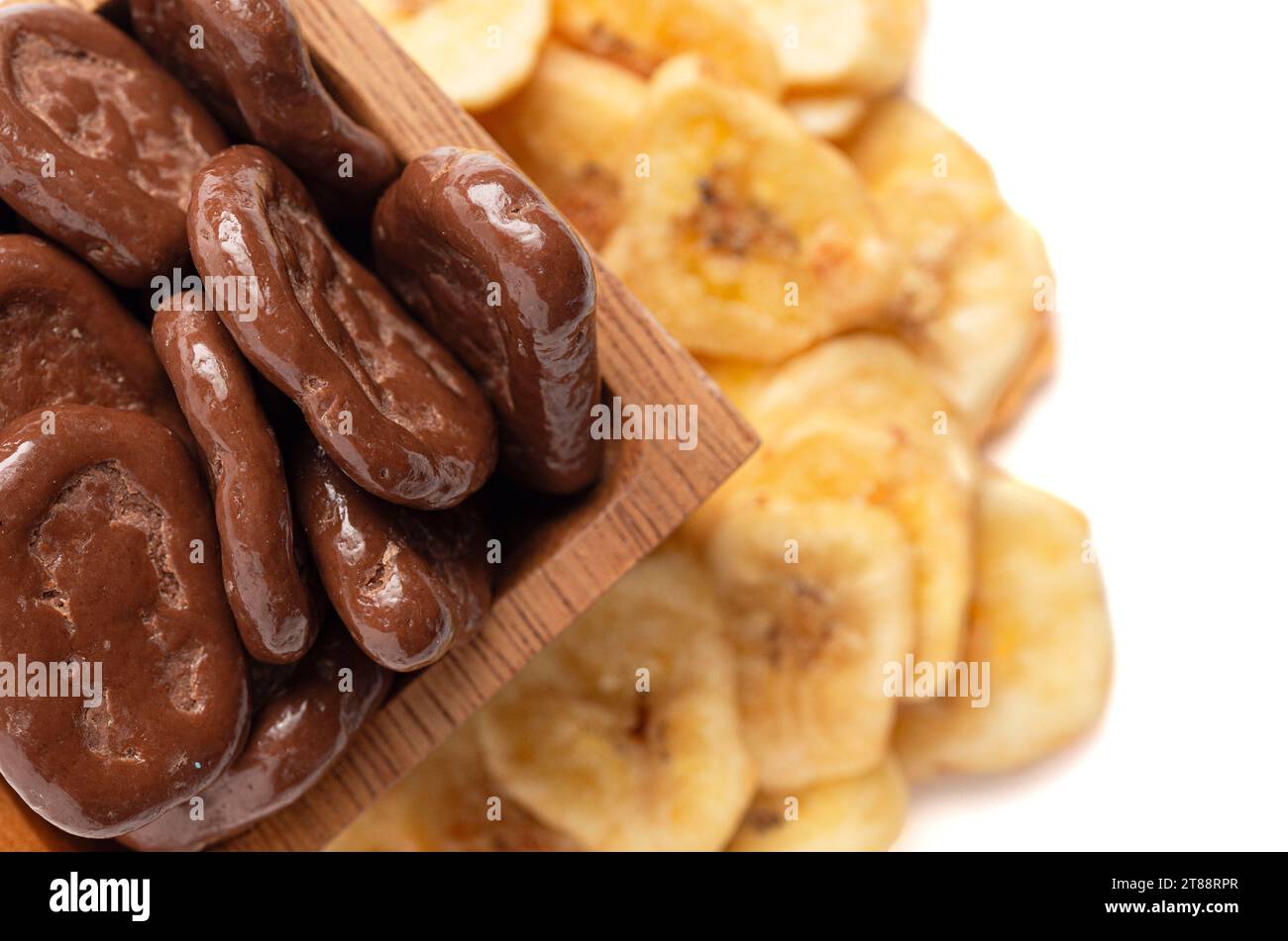 Sweet Chocolate Covered Banana Chips and Original Banana Chips Isolated on a White Background Stock Photo