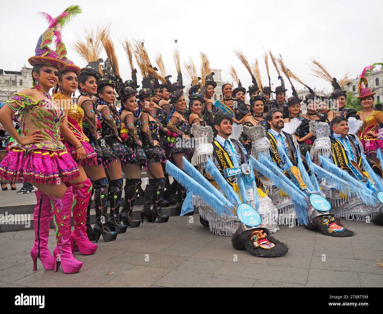 Lima, Peru. 18th Nov, 2023. Dancing women wearing traditional costumes dance through the streets of lima downtown, as part of La Candelaria 2024 festival launching. The Andean Festival, originally from Puno and Bolivia, and celebrated in January, has been brought to the capital many years ago by the indigenous migrants. Credit: Fotoholica Press Agency/Alamy Live News Stock Photo