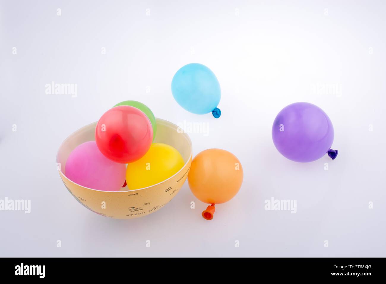 Colorful small baloons in a globe on a white background Stock Photo - Alamy