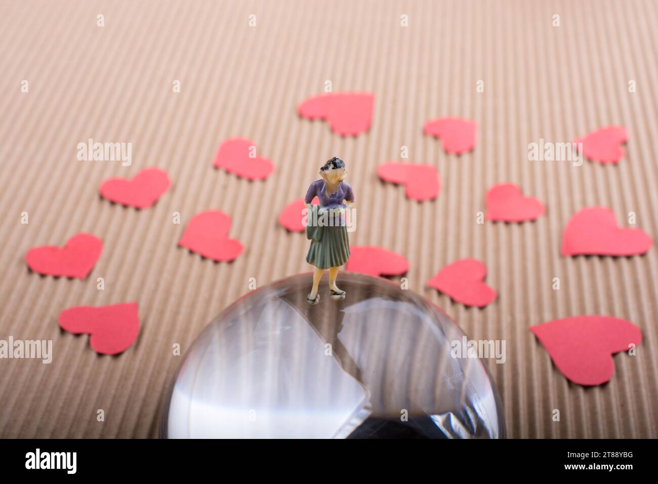 Woman figurine and Love concept with red paper hearts Stock Photo - Alamy