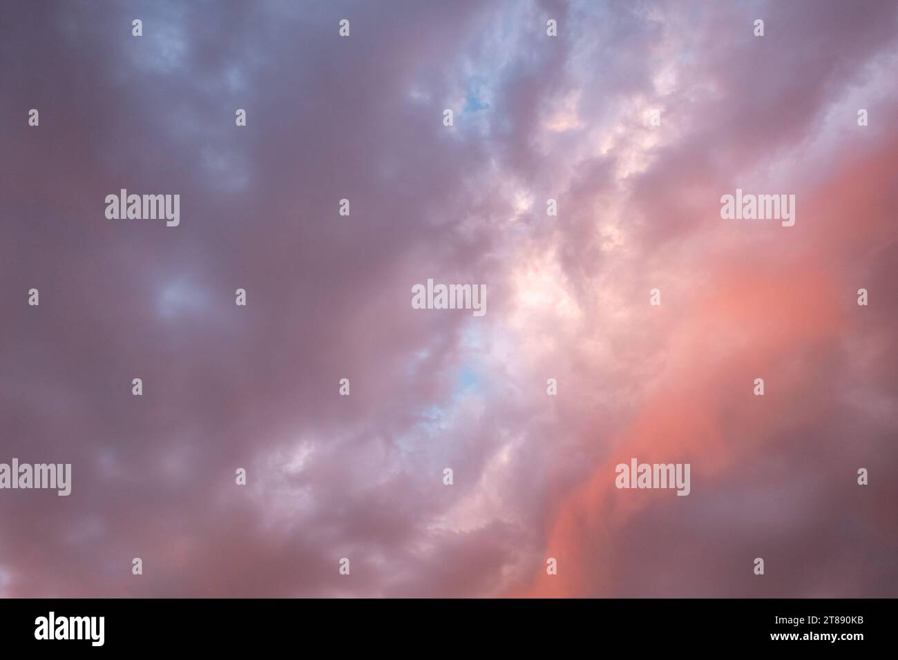 A beautiful sunset sky with pink and purple clouds with soft colors ...