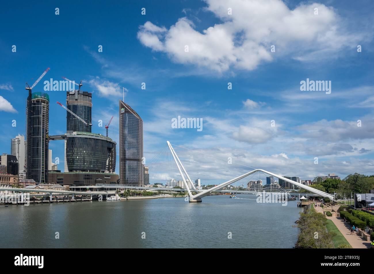 A view from Southbank Victoria Bridge along the Brisbane River toward the Neville Bonner Bridge with Queen's Wharf on the left-hand side. Stock Photo