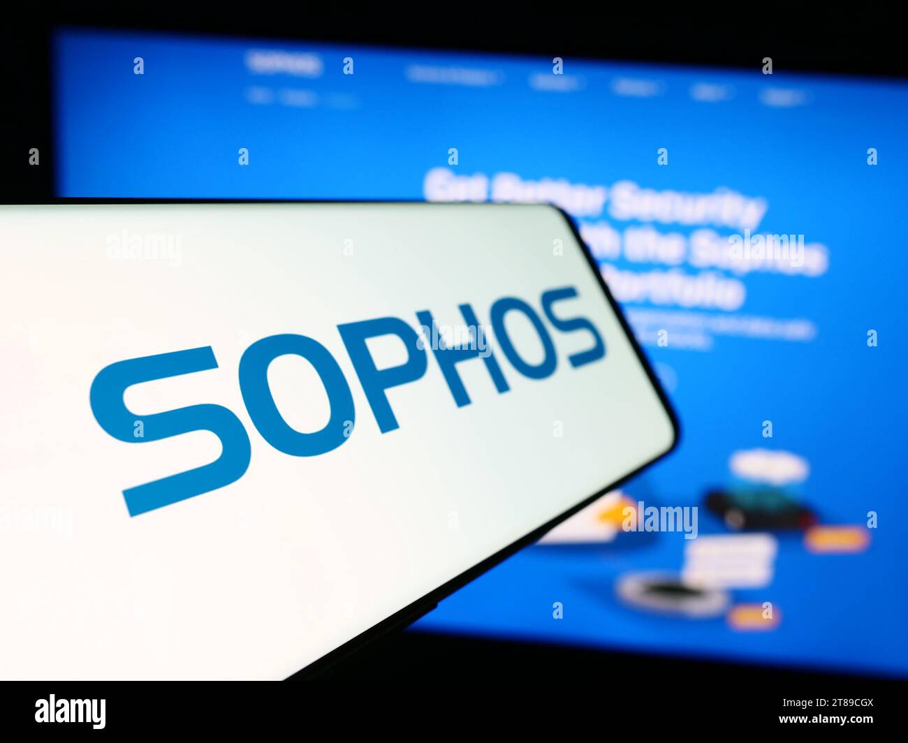 Mobile phone with logo of British security software company Sophos Group plc in front of business website. Focus on left of phone display. Stock Photo