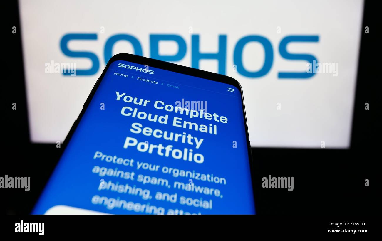 Smartphone with website of British security software company Sophos Group plc in front of business logo. Focus on top-left of phone display. Stock Photo