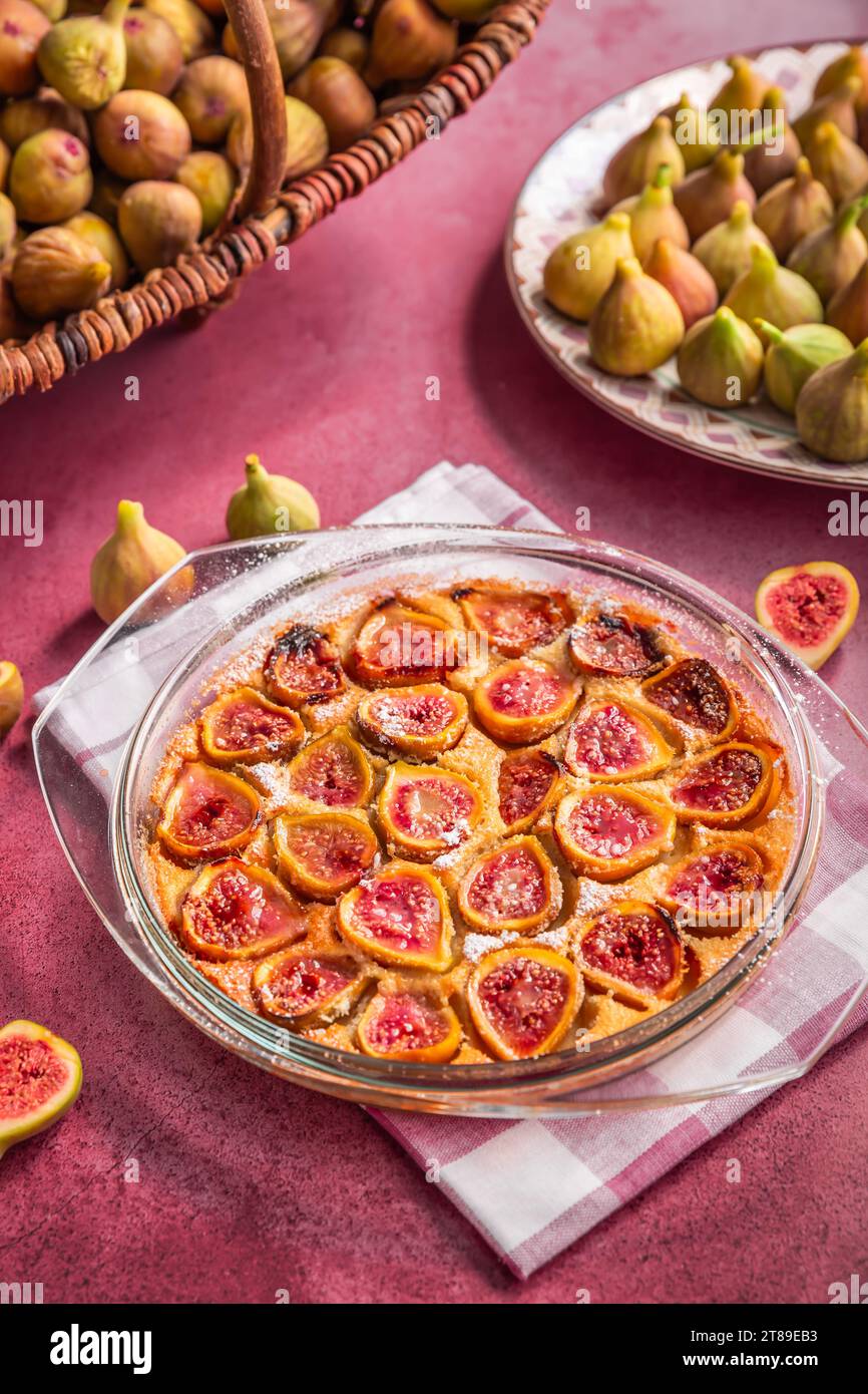 French fig clafoutis with almonds in baking form, glutenfree dessert Stock Photo