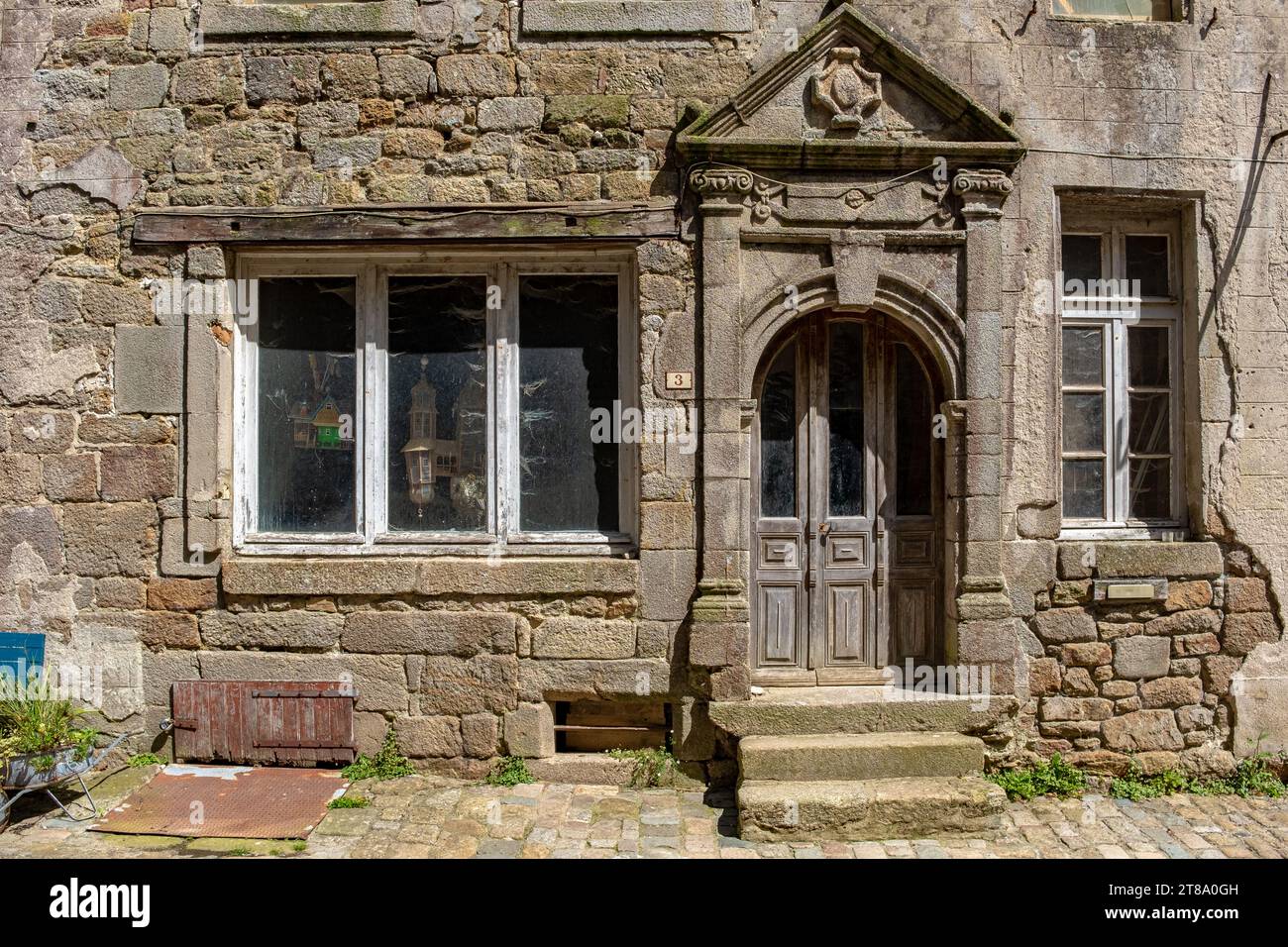 The renaissance entrance of a house in Moncontour, Brittany, France, taken on a sunny summer day with no people Stock Photo