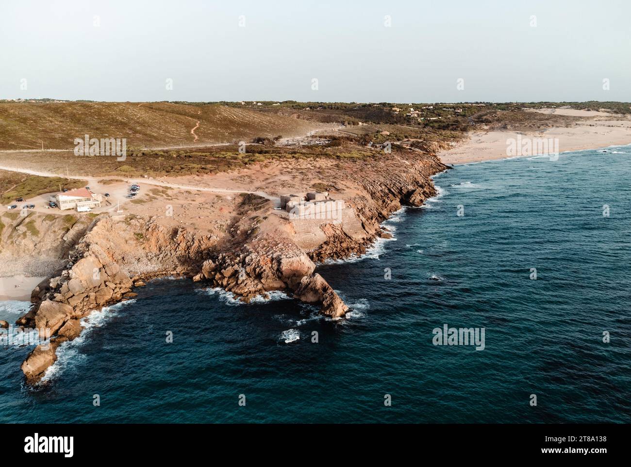 Aerial photo of cliff on the coastline in Portugal with fortress and ...