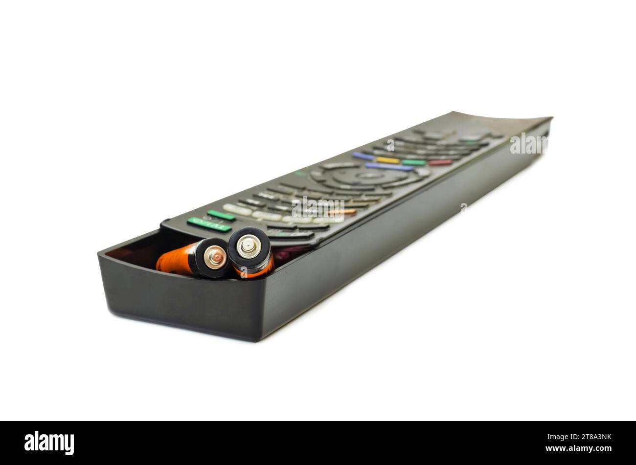 AA batteries and TV remote control. Replacing the batteries in the remote control Stock Photo