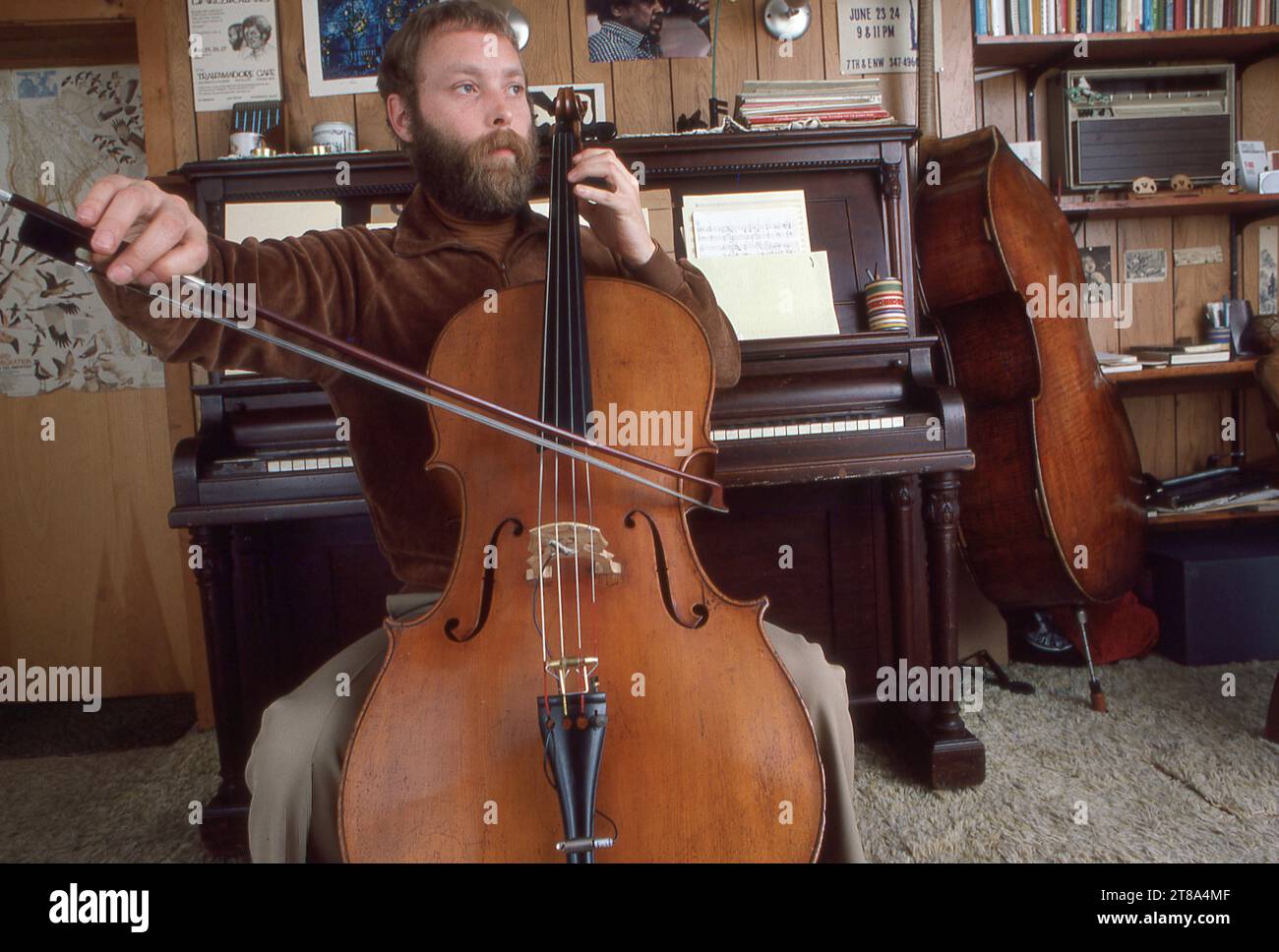 A 1983 portrait of English jazz double bassist, composer & bandleader Dave Holland practicing in his home studio in upstate New York. Stock Photo