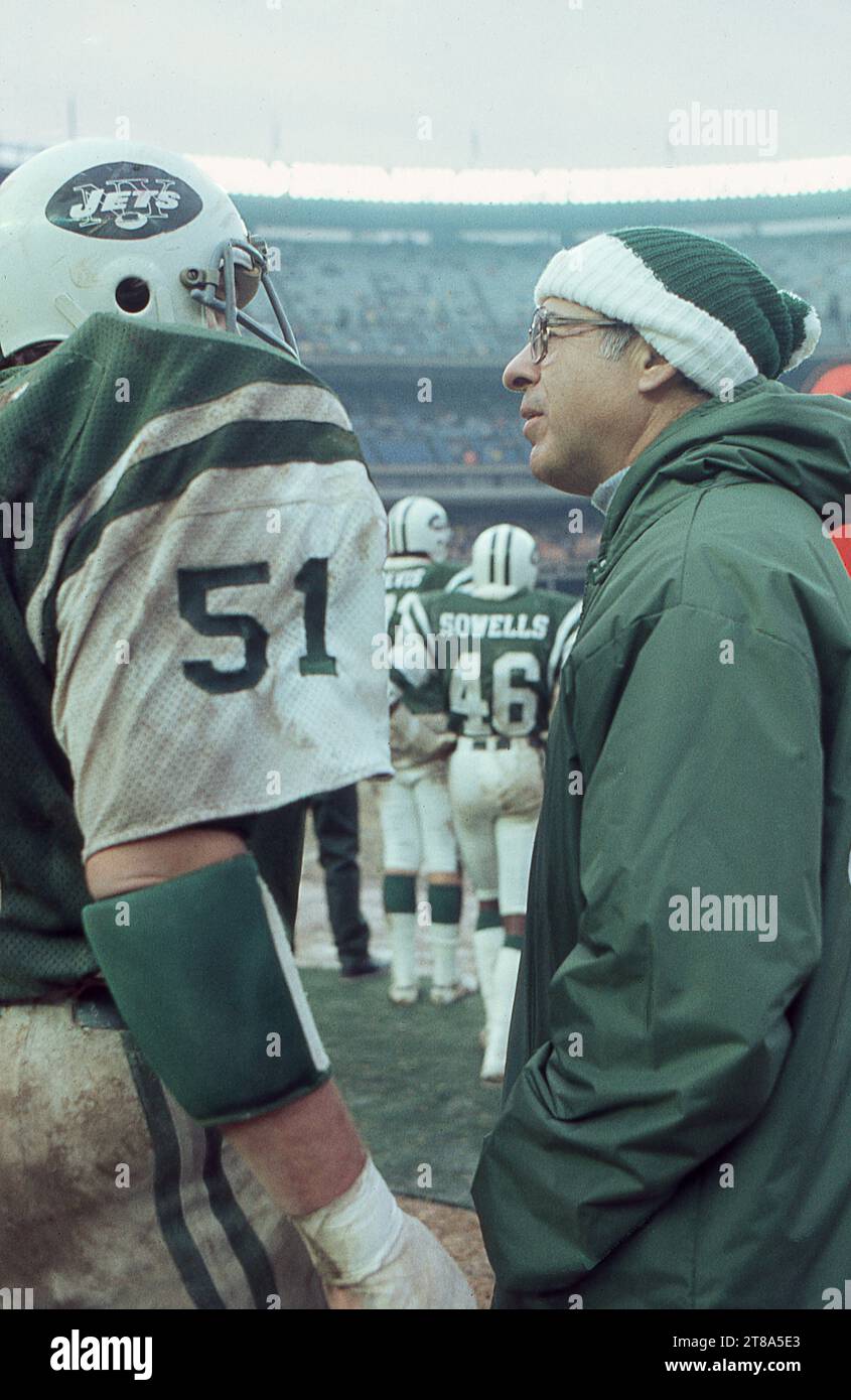 Sports medicine pioneer Dr. James Nicholas talks to NFL linebacker Greg Buttle on the sidelines during a game at Shea Stadium in 1978, in Flushing, Queens, New York. He was the team orthopedic doctor. Stock Photo