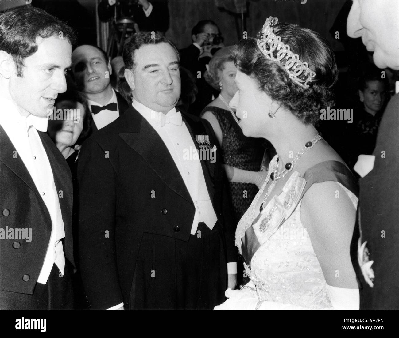 Composer JOHN BARRY talking to QUEEN ELIZABETH II on March 14th 1966 at the Royal Film Performance of BORN FREE 1966 director JAMES HILL book Joy Adamson music John Barry Open Road Films / Atlas / Highroad / Columbia Pictures Corporation Stock Photo