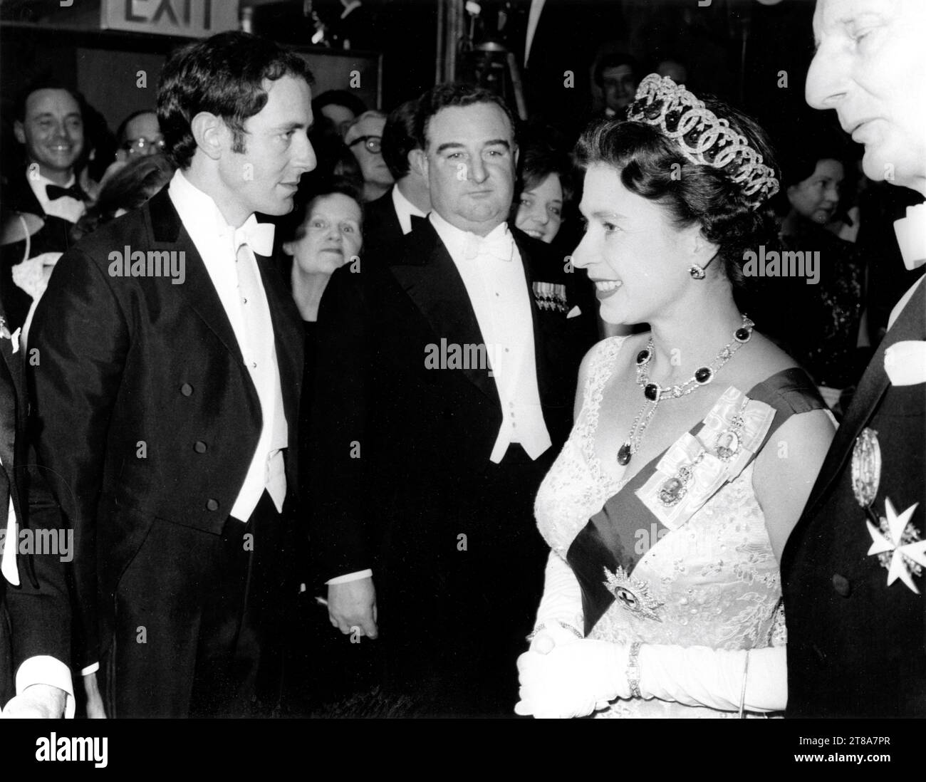 Composer JOHN BARRY talking to QUEEN ELIZABETH II on March 14th 1966 at the Royal Film Performance of BORN FREE 1966 director JAMES HILL book Joy Adamson music John Barry Open Road Films / Atlas / Highroad / Columbia Pictures Corporation Stock Photo