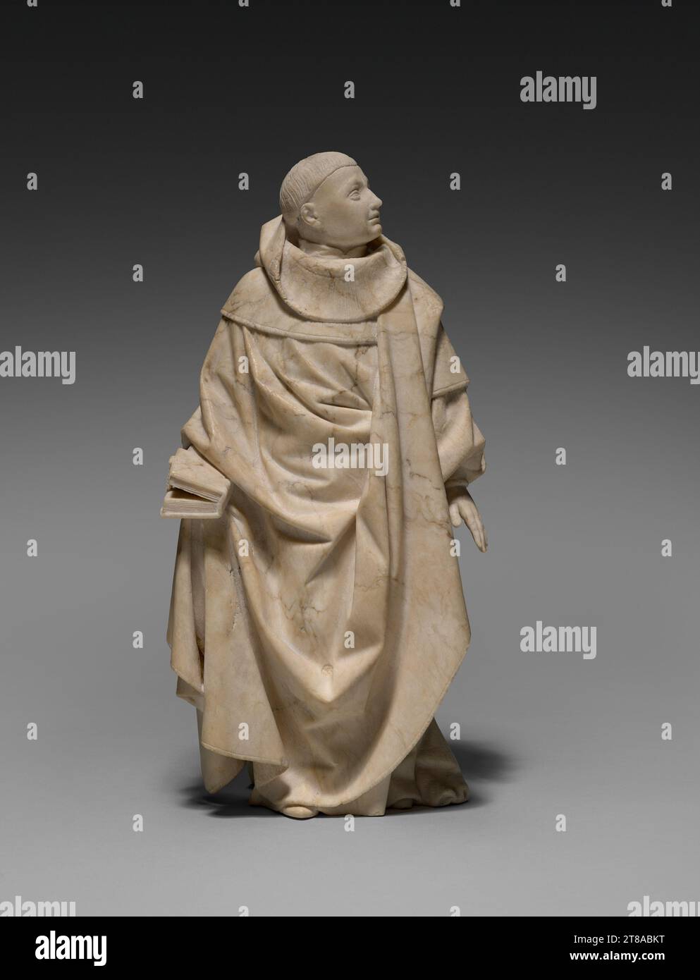 This monk-like figure has a variously textured monochrome surface 