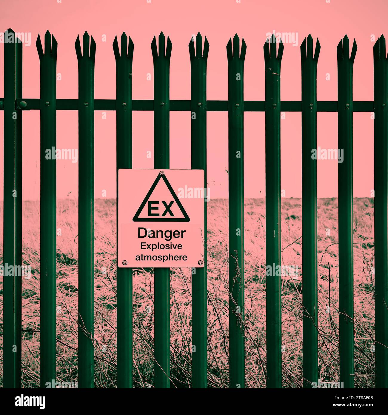 Danger expolosive atmosphere  sign on fence at old landfil site Stock Photo