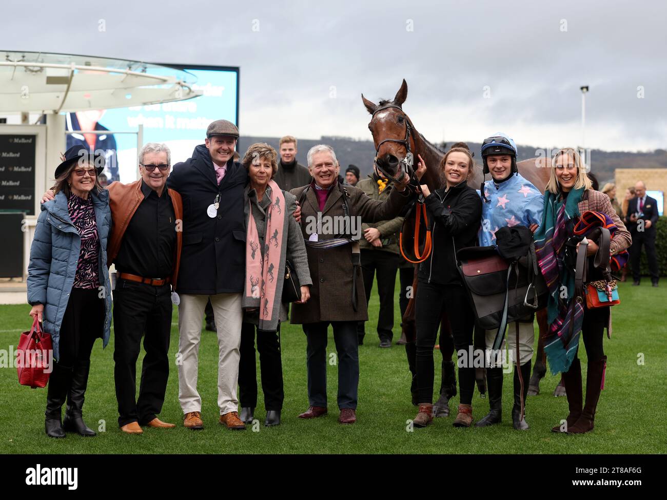 Cannock Park, Jocket Criag Nichol (second right) and trainer Paul Robson (third left) pose with winning connections after winning The mallardjewellers.com Maiden Hurdle on day three of The November Meeting at Cheltenham Racecourse. Picture date: Sunday November 19, 2023. Stock Photo