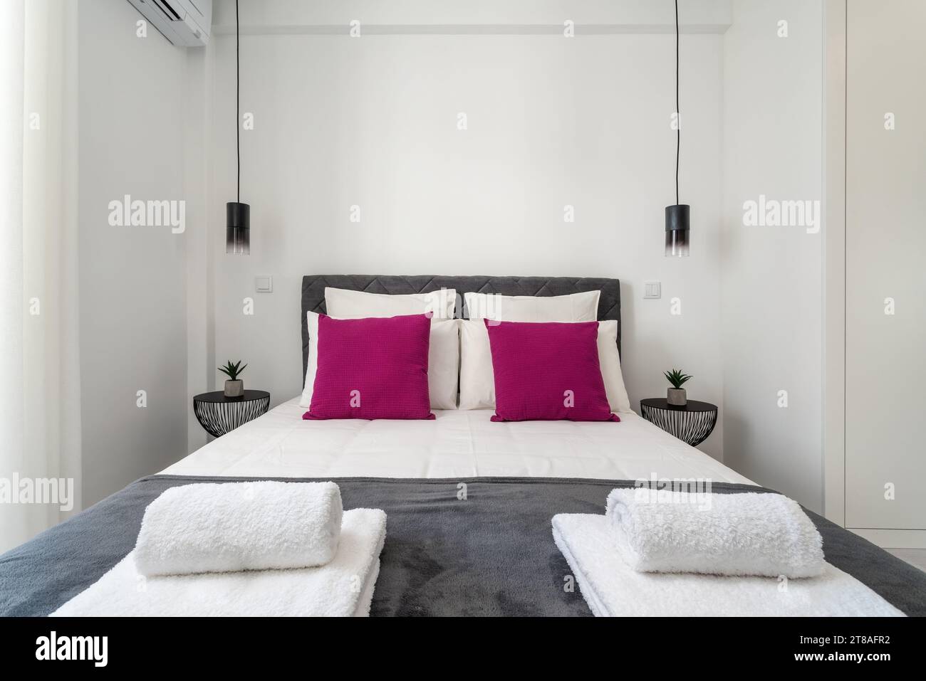 Double bed in the bright bedroom room interior furnishing furniture