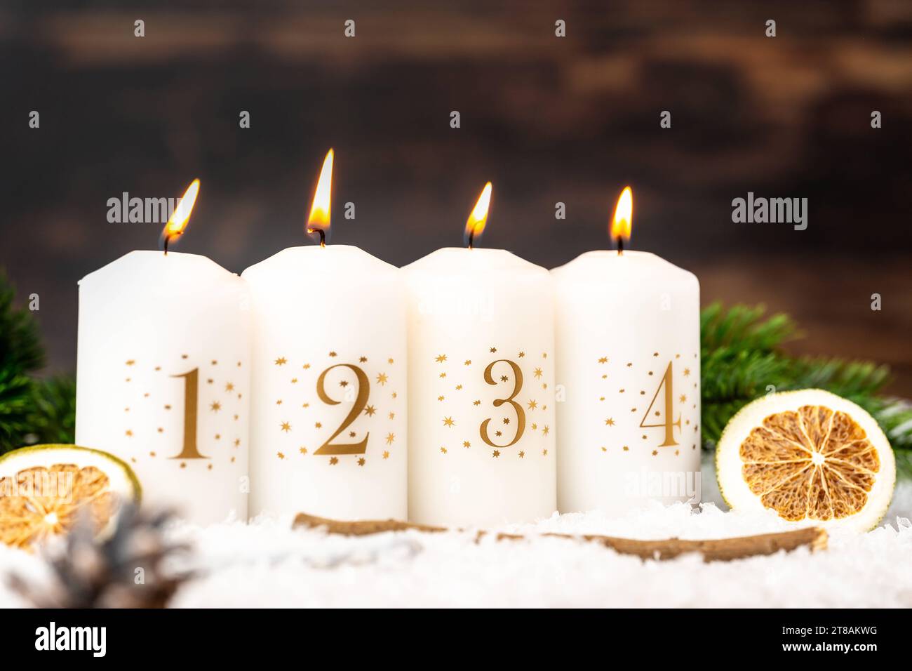 Augsburg, Bavaria, Germany - November 17, 2023: Four candles burning on the fourth Advent. 4th Sunday of Advent symbolic image, white candles in winter landscape *** Vier Kerzen brennen am vierten Advent. 4. Adventssonntag Symbolbild, weiße Kerzen in Winterlandschaft Credit: Imago/Alamy Live News Stock Photo
