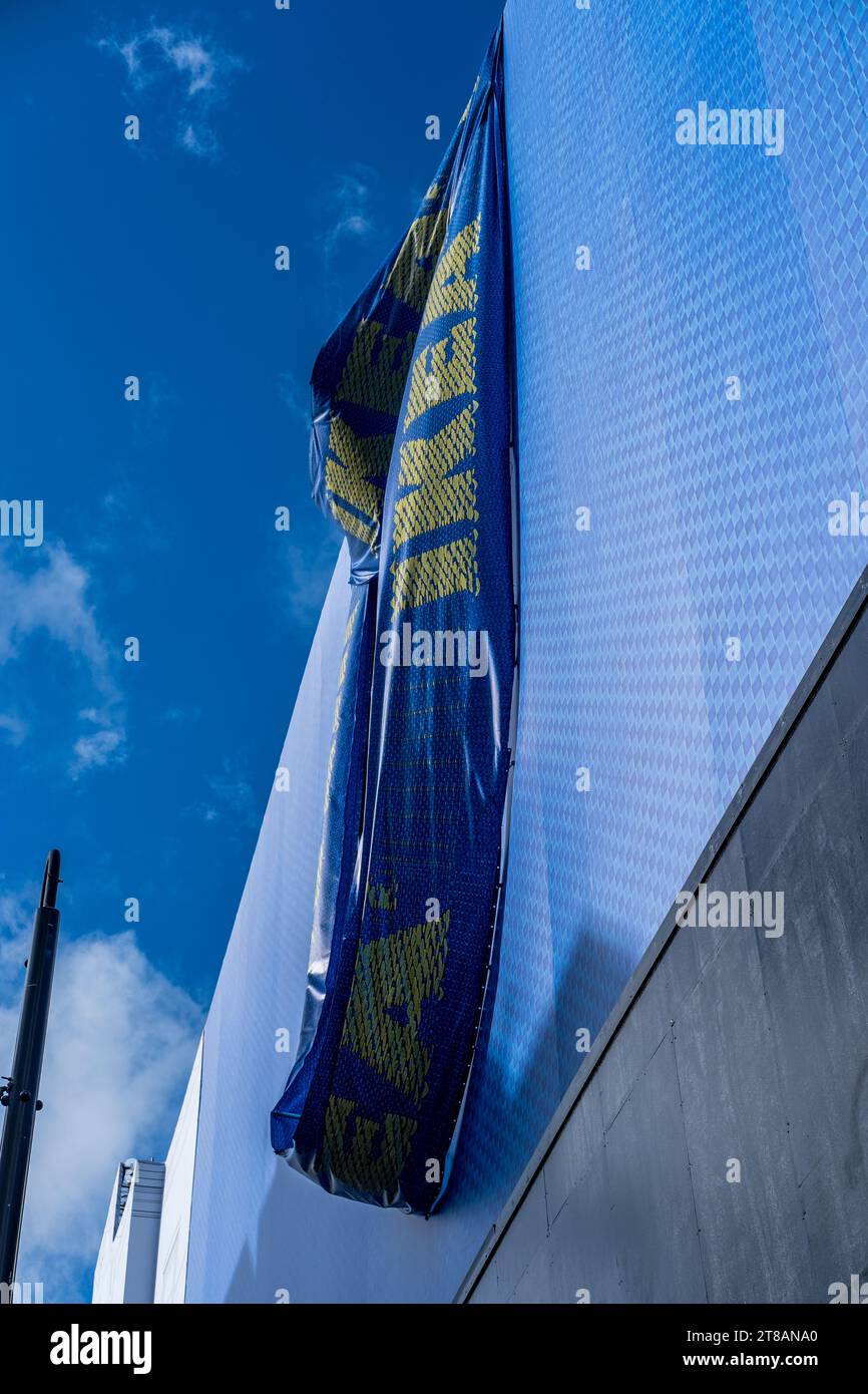 Massive Blue Ikea sign drapes over iconic building (formerly Top Shop) whilst new Ikea Store is being constructed on Oxford Street, Central London. Stock Photo